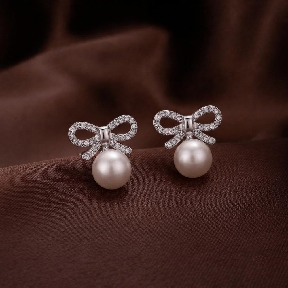 JewelMaze Silver Plated Bow Shape Austrian Stone & Pearl Stud Earrings for Women