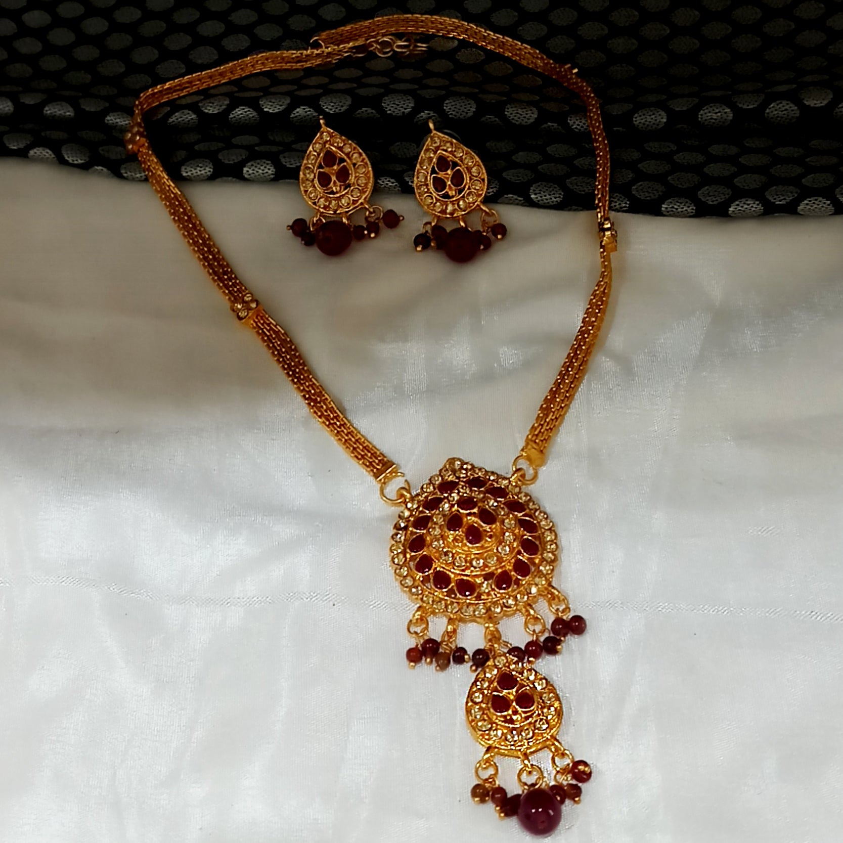 JewelMaze Gold Plated Maroon Austrian Stone Necklace Set